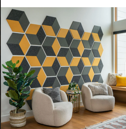 Acoustic wall panels made of PET felt in hexagon pattern on living room wall